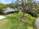 Aerial view showcasing the fenced backyard, lush greenery, and peaceful surroundings at 4009 Carrollwood Village Dr, Tampa, FL 33618