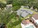 Expansive aerial view of a well-manicured lawn and a luxurious outdoor entertainment area with gazebo at 4009 Carrollwood Village Dr, Tampa, FL 33618