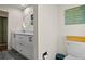 Bathroom featuring double sink vanity with quartz countertops and stylish decor at 4009 Carrollwood Village Dr, Tampa, FL 33618