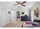 Cozy baseball themed bedroom with natural lighting, large closet space and ceiling fan at 4009 Carrollwood Village Dr, Tampa, FL 33618