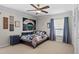Bedroom with baseball-themed decor, a ceiling fan, and cozy accents at 4009 Carrollwood Village Dr, Tampa, FL 33618
