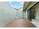 Spacious courtyard with wood flooring, offering privacy and connection to an indoor bathroom at 4009 Carrollwood Village Dr, Tampa, FL 33618