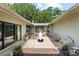 Picturesque courtyard featuring patio, greenery, and multiple seating areas at 4009 Carrollwood Village Dr, Tampa, FL 33618