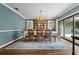 Charming dining room with decorative rug and chandelier at 4009 Carrollwood Village Dr, Tampa, FL 33618