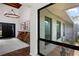 Elegant foyer with a wooden chandelier, brick floor, double doors, and a unique natural wood console table at 4009 Carrollwood Village Dr, Tampa, FL 33618