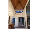 Bright foyer with wood ceiling, brick floor, and modern chandelier at 4009 Carrollwood Village Dr, Tampa, FL 33618