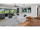 Bright living room features brick flooring and sliding glass doors to an outdoor area at 4009 Carrollwood Village Dr, Tampa, FL 33618