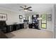 Bright office space featuring a ceiling fan, and a black desk and cabinets at 4009 Carrollwood Village Dr, Tampa, FL 33618