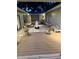Peaceful patio with ambient lighting, a combination of stone and wood flooring, and lush greenery at 4009 Carrollwood Village Dr, Tampa, FL 33618