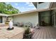 Charming outdoor patio area with stone flooring, various seating arrangements, and well-placed potted plants at 4009 Carrollwood Village Dr, Tampa, FL 33618