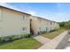 A view of a condominium complex showing a well-maintained exterior, landscaping, and easy access walkways at 4215 East Bay Dr # 1103D, Clearwater, FL 33764
