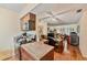 A kitchen with a breakfast bar that opens to the living room and includes wood cabinets and laminate countertops at 4215 East Bay Dr # 1103D, Clearwater, FL 33764
