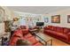 Cozy living room with comfortable seating, laminate floors and natural light at 4215 East Bay Dr # 1103D, Clearwater, FL 33764