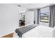 Bright bedroom featuring a neutral color scheme and a large window at 4432 W Mccoy St, Tampa, FL 33616
