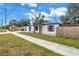 Charming home with a sidewalk, a well kept lawn and trees, featuring classic suburban curb appeal at 4432 W Mccoy St, Tampa, FL 33616