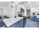Open kitchen featuring quartz countertops, sleek appliances, stylish tile floors and blue bottom cabinets at 4432 W Mccoy St, Tampa, FL 33616