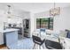 Open-concept kitchen and breakfast nook featuring modern finishes and ample natural light with coordinated aesthetic at 4432 W Mccoy St, Tampa, FL 33616