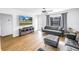 Comfortable living room with modern furnishings, a large screen television, and plenty of natural light at 4432 W Mccoy St, Tampa, FL 33616