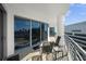 Inviting balcony with comfortable seating, offering stunning city views through sliding glass doors at 449 S 12Th St # 2205, Tampa, FL 33602