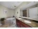 Elegant bathroom with double sinks, granite countertops, a soaking tub, and a separate shower at 449 S 12Th St # 2205, Tampa, FL 33602