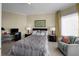 Relaxing bedroom features a comfortable bed, soft lighting, and a cozy chair with cityscape views at 449 S 12Th St # 2205, Tampa, FL 33602