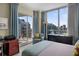Stylish bedroom with balcony access, large windows offering expansive city views, and contemporary furnishings at 449 S 12Th St # 2205, Tampa, FL 33602