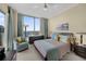 Cozy bedroom featuring large windows with city views, stylish decor, and comfortable furnishings at 449 S 12Th St # 2205, Tampa, FL 33602
