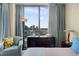 Comfortable bedroom with large windows offering stunning city views, complemented by elegant curtains and decor at 449 S 12Th St # 2205, Tampa, FL 33602