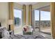 Inviting bedroom with a plush bed, cityscape views, and a cozy chair in a sunlit corner at 449 S 12Th St # 2205, Tampa, FL 33602