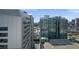 A close, urban view from a high rise overlooking streets, parking, and neighboring buildings at 449 S 12Th St # 2205, Tampa, FL 33602