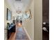 Elegant hallway with hardwood floors, sophisticated decor, and a view of the living area with city views at 449 S 12Th St # 2205, Tampa, FL 33602