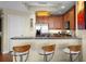 Modern kitchen featuring a breakfast bar with granite countertops and stainless steel appliances at 449 S 12Th St # 2205, Tampa, FL 33602