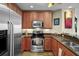 Stylish kitchen with stainless steel appliances and countertops, offering cooking space at 449 S 12Th St # 2205, Tampa, FL 33602