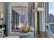 Cozy living room featuring a floor lamp and sliding door to the balcony with outdoor seating and stunning views at 449 S 12Th St # 2205, Tampa, FL 33602