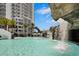 Resort pool featuring a waterfall, ample seating, and views of the surrounding condominium complex at 449 S 12Th St # 2205, Tampa, FL 33602
