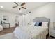 Bright bedroom features a comfortable bed, soft textures, and is adjacent to the bathroom at 4681 70Th N Ave, Pinellas Park, FL 33781