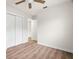 Empty bedroom features a large closet, neutral colors, and hardwood floors at 4681 70Th N Ave, Pinellas Park, FL 33781