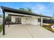 Beautifully renovated home with a covered carport, a modern front door, and colorful landscaping at 4681 70Th N Ave, Pinellas Park, FL 33781