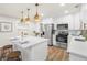 Beautiful kitchen featuring an island with pendant lighting, stainless steel appliances, and a cozy breakfast bar at 4681 70Th N Ave, Pinellas Park, FL 33781