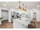 Bright kitchen features white cabinetry, stainless steel appliances, and a center island with seating at 4681 70Th N Ave, Pinellas Park, FL 33781