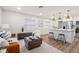 Open-concept living space with modern furniture, natural light, and views of the stylish kitchen area at 4681 70Th N Ave, Pinellas Park, FL 33781