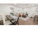 Cozy living room is decorated with stylish furniture, natural light, and an adjacent dining area at 4681 70Th N Ave, Pinellas Park, FL 33781