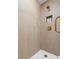 Detailed shot of the new shower shows vertically laid tile and stylish gold shower fixtures at 4681 70Th N Ave, Pinellas Park, FL 33781