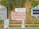 An aerial shot highlighting the house's layout, roofing, and location within the community at 5033 Tammy Ln, Holiday, FL 34690