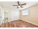 Inviting bedroom with hardwood floors, a ceiling fan, large closet, and ample natural light at 5033 Tammy Ln, Holiday, FL 34690
