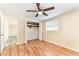 Bedroom features hard surface floors, a ceiling fan, natural light and a closet with shelving at 5033 Tammy Ln, Holiday, FL 34690