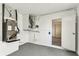 A clean garage space featuring modern HVAC equipment and epoxy floor, offering efficient storage at 5033 Tammy Ln, Holiday, FL 34690