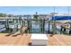 Dock with a boat lift and a boat on the lift at 5037 Starfish Se Dr # A, St Petersburg, FL 33705