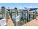 A boat lift with a boat on it in the water at 5037 Starfish Se Dr # A, St Petersburg, FL 33705