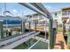Dock showing multiple boat lifts and boat docks along a waterfront condo at 5037 Starfish Se Dr # A, St Petersburg, FL 33705
